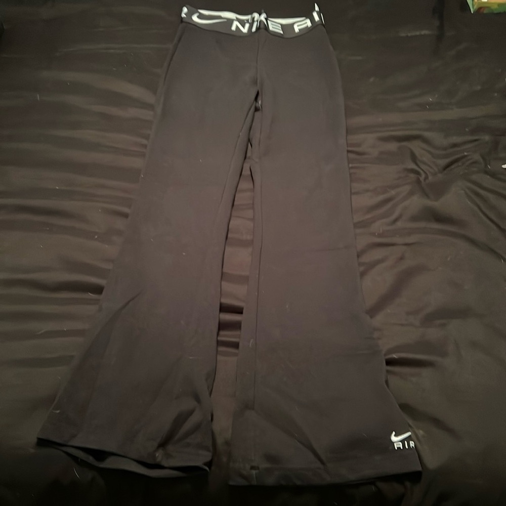 Nike Air women’s black flare leggings. 
Medium